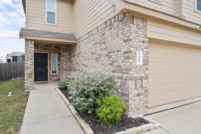 property entrance with a garage