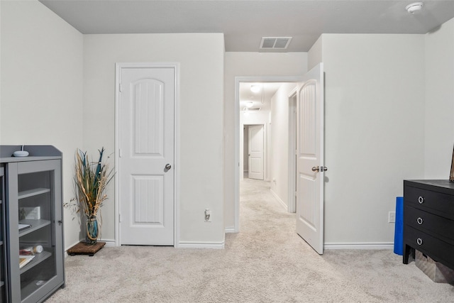 bedroom with light colored carpet