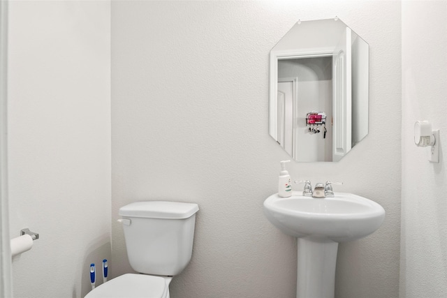 bathroom featuring toilet