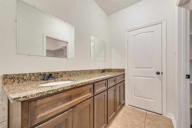 bathroom with tile patterned floors and vanity