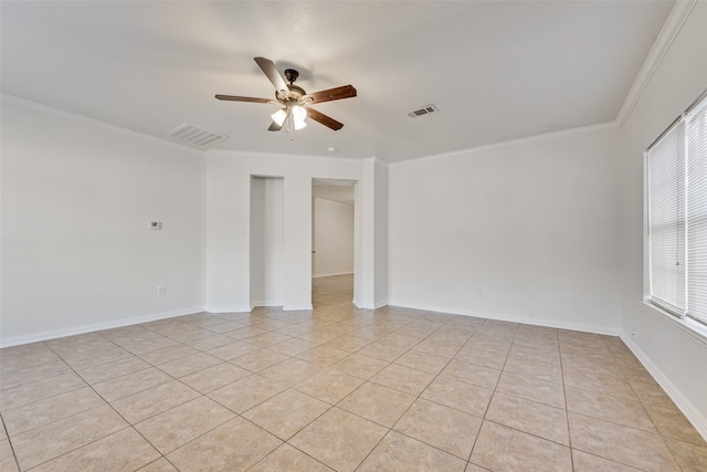 unfurnished room with ceiling fan, light tile patterned floors, and ornamental molding