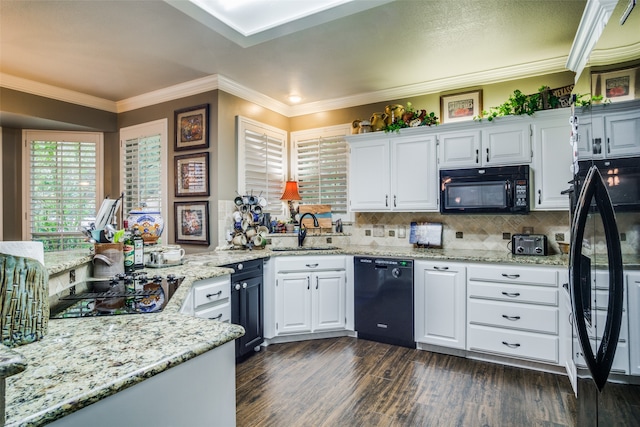 kitchen featuring black appliances, dark wood-type flooring, sink, and white cabinets