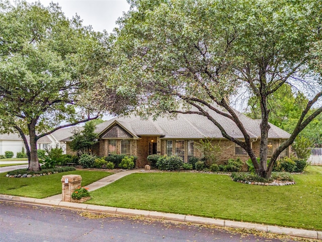 ranch-style house with a front lawn