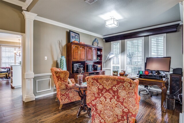 home office with ornamental molding, a notable chandelier, dark wood-type flooring, and decorative columns