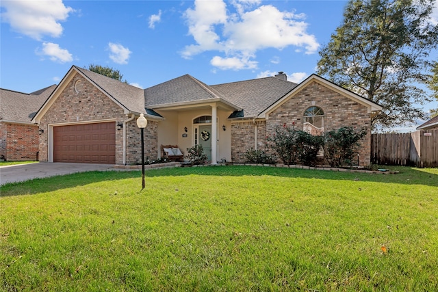 ranch-style home featuring a garage and a front lawn