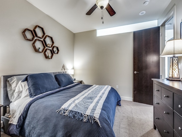 carpeted bedroom featuring ceiling fan