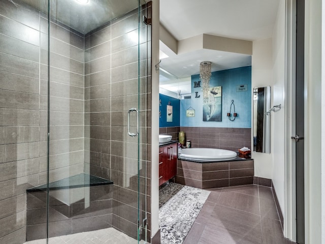 bathroom with tile patterned flooring, vanity, and independent shower and bath