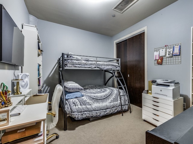 bedroom featuring light carpet