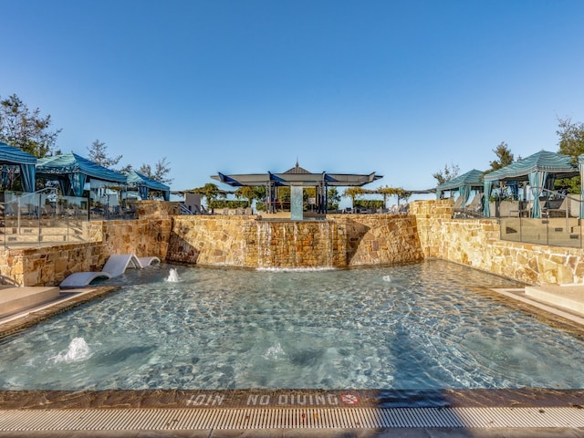 view of pool featuring pool water feature