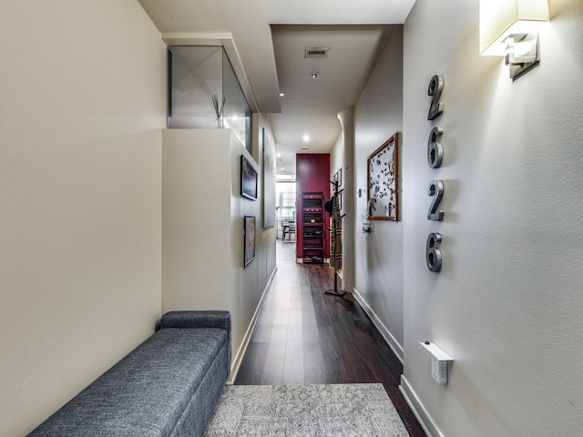 hallway with dark wood-type flooring