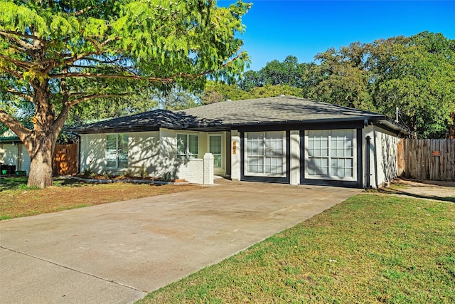 ranch-style house with a front lawn