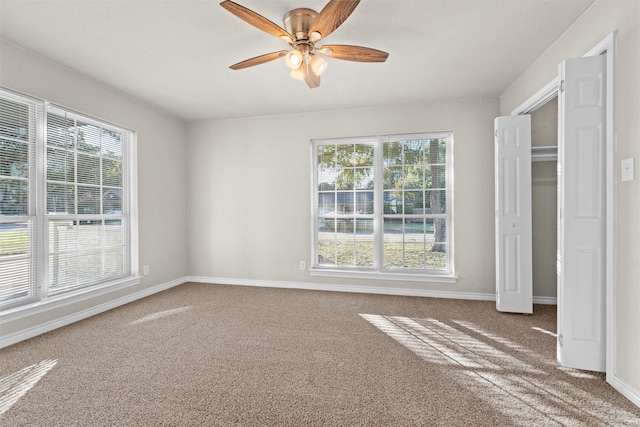 unfurnished bedroom with carpet floors and ceiling fan