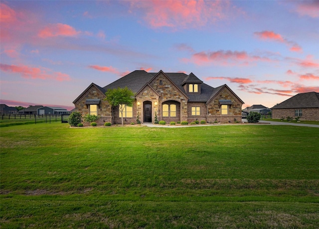 13401 Moorhouse Way, Justin, TX 76247 - french country inspired facade with stone siding, a lawn, and fence