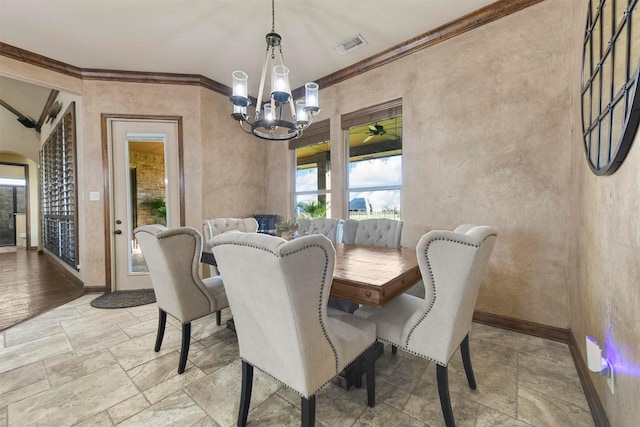 dining area featuring an inviting chandelier and ornamental molding