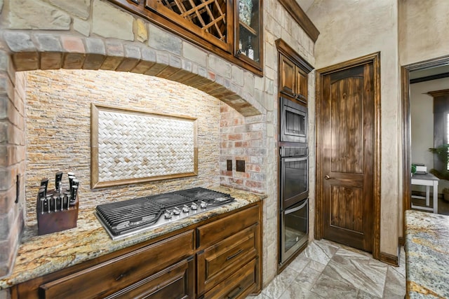 13401 Moorhouse Way, Justin, TX 76247 - kitchen with light stone countertops, glass insert cabinets, and appliances with stainless steel finishes