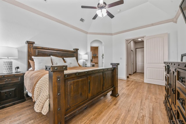 bedroom featuring ornamental molding, high vaulted ceiling, ceiling fan, and light hardwood / wood-style flooring