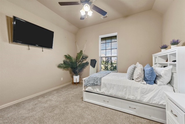 carpeted bedroom featuring vaulted ceiling and ceiling fan