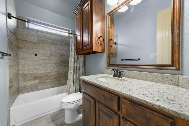 full bathroom featuring shower / bathtub combination with curtain, vanity, and toilet