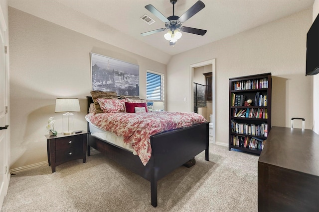 carpeted bedroom featuring lofted ceiling and ceiling fan