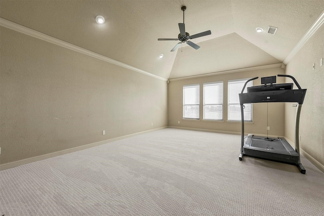 workout area featuring vaulted ceiling, light carpet, ceiling fan, and crown molding