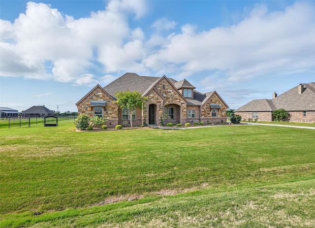 13401 Moorhouse Way, Justin, TX 76247 - french provincial home featuring stone siding, a front lawn, and fence