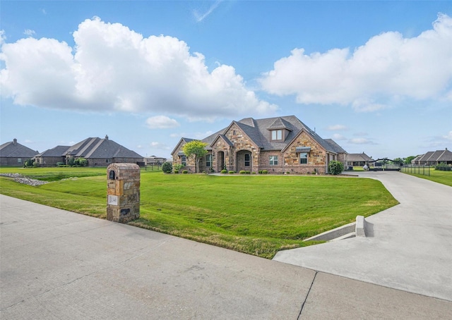 13401 Moorhouse Way, Justin, TX 76247 - view of front of house with stone siding, a front lawn, and concrete driveway