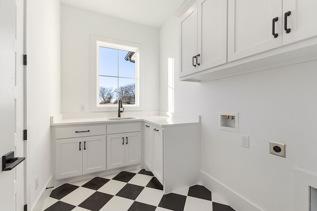 laundry area featuring hookup for a washing machine, cabinets, sink, and hookup for an electric dryer