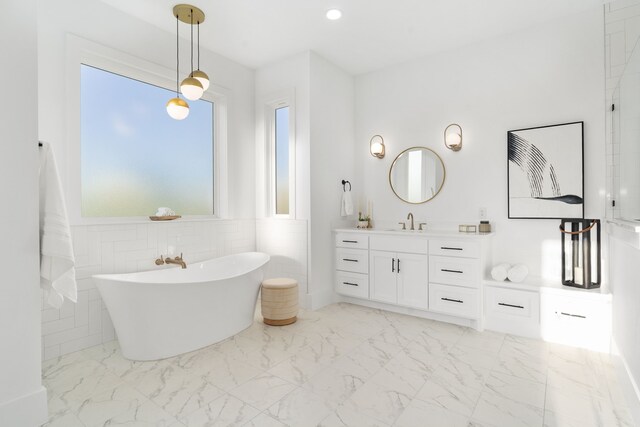 7745 Laura Lake Ln, Fort Worth, TX 76126 - full bathroom featuring marble finish flooring, a freestanding bath, and vanity