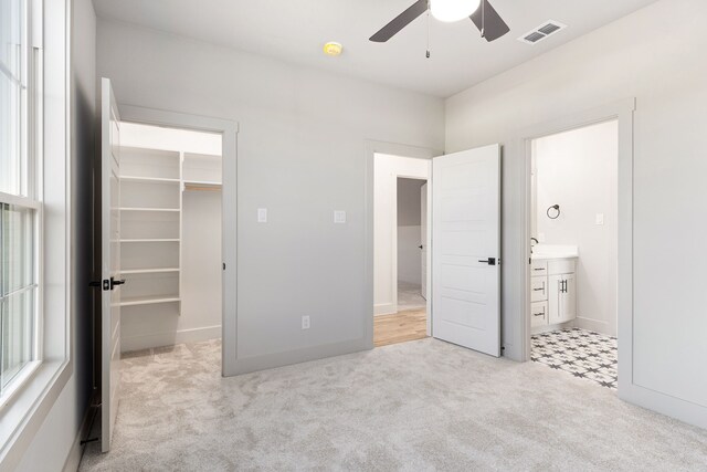 7745 Laura Lake Ln, Fort Worth, TX 76126 - unfurnished bedroom with a walk in closet, carpet floors, ensuite bathroom, a closet, and baseboards