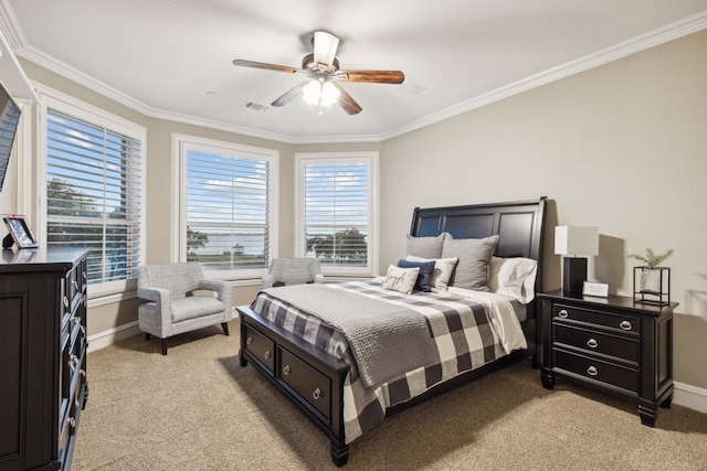 carpeted bedroom with multiple windows, ceiling fan, and ornamental molding