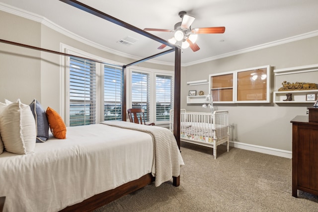 carpeted bedroom with ceiling fan and ornamental molding