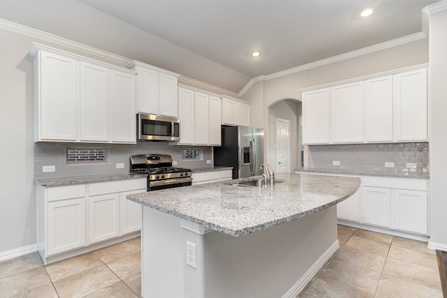 kitchen with stainless steel appliances, white cabinets, and sink