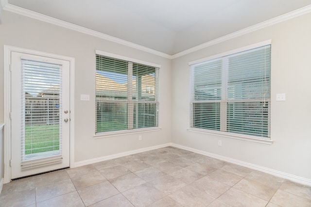 tiled spare room featuring ornamental molding