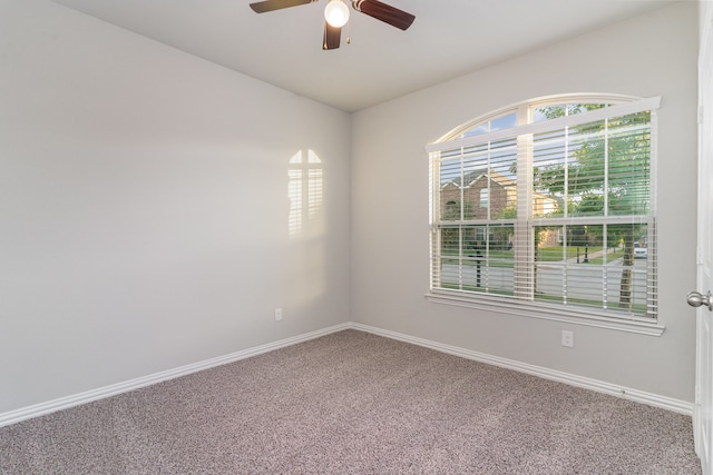 unfurnished room featuring carpet and ceiling fan