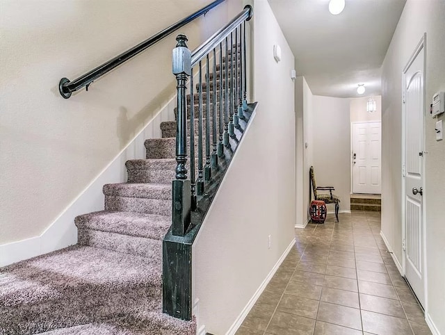 stairs with tile patterned floors