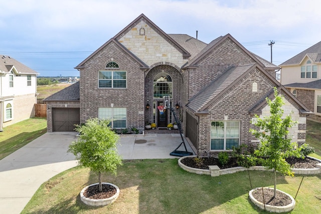 view of front of house with a front lawn and a garage