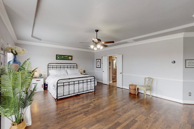 bedroom with ornamental molding, ensuite bath, ceiling fan, and dark hardwood / wood-style floors