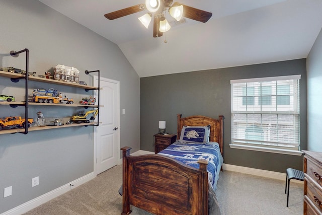 bedroom with light colored carpet, lofted ceiling, and ceiling fan