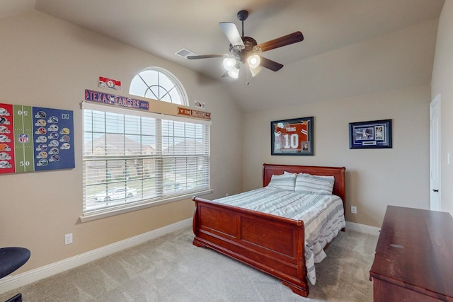 bedroom featuring multiple windows, lofted ceiling, and ceiling fan