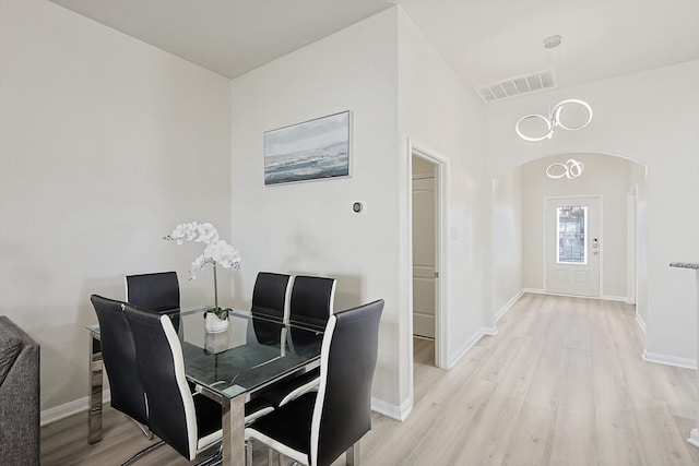 dining space with light hardwood / wood-style flooring