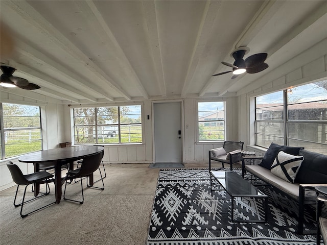 sunroom with beam ceiling and ceiling fan