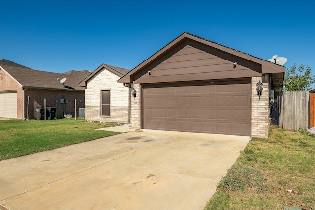 view of front of house with a front lawn and a garage