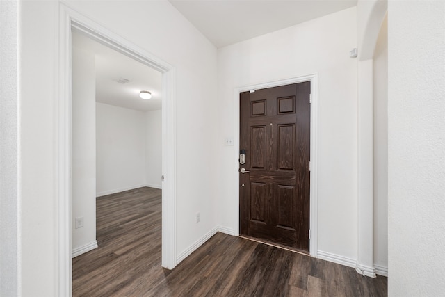 foyer with dark hardwood / wood-style floors