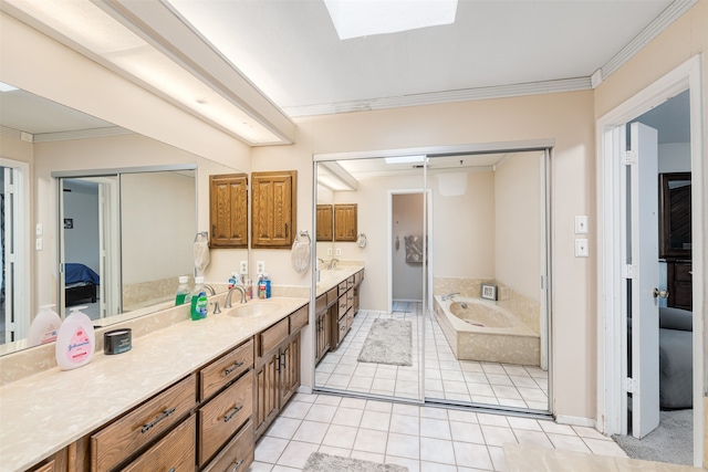 bathroom with a bath, tile patterned floors, crown molding, vanity, and a skylight