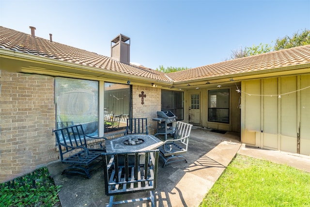 view of patio with a grill