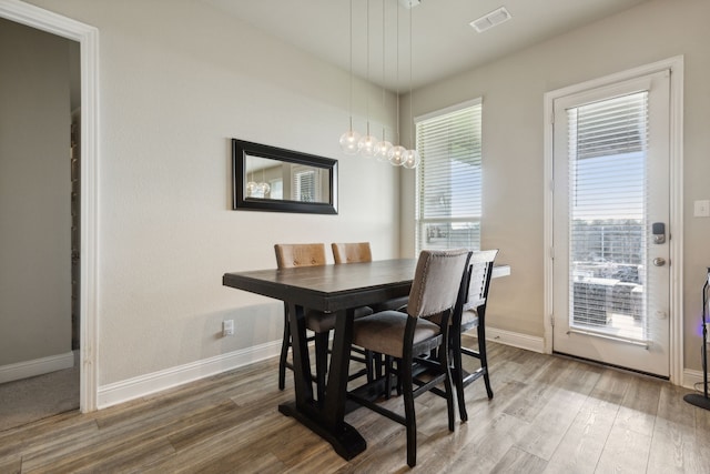 dining area with hardwood / wood-style flooring