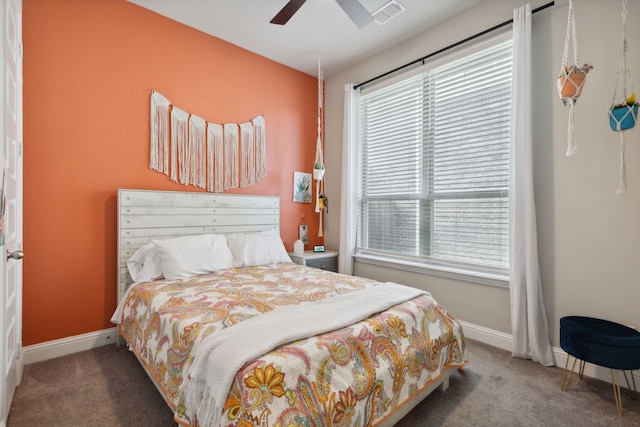 bedroom with ceiling fan and carpet floors