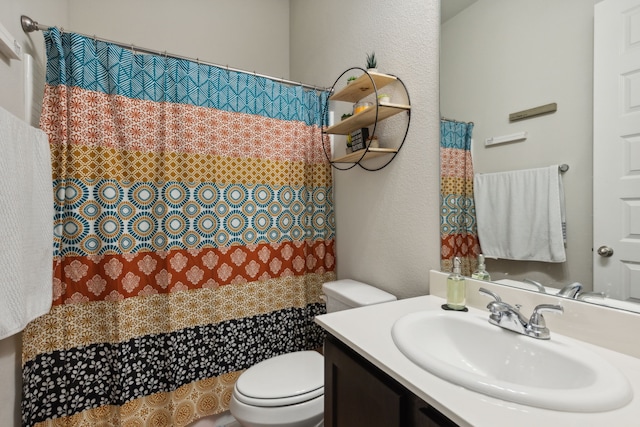 2277 Sheppards Ln, Waxahachie, TX 75167 - full bath featuring toilet, vanity, curtained shower, and a textured wall