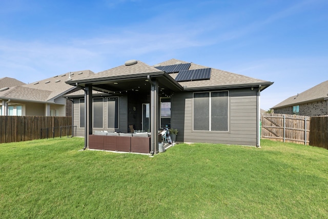 back of property featuring outdoor lounge area and a lawn