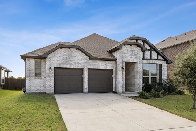 view of front facade featuring a garage and a front lawn